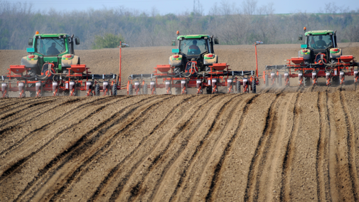 Tractors prepping field