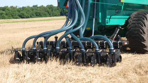 Manure being injected in wheat residue