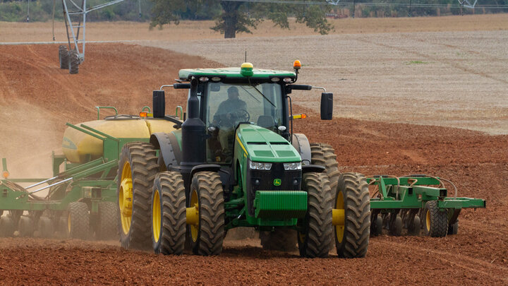 tractor plows field