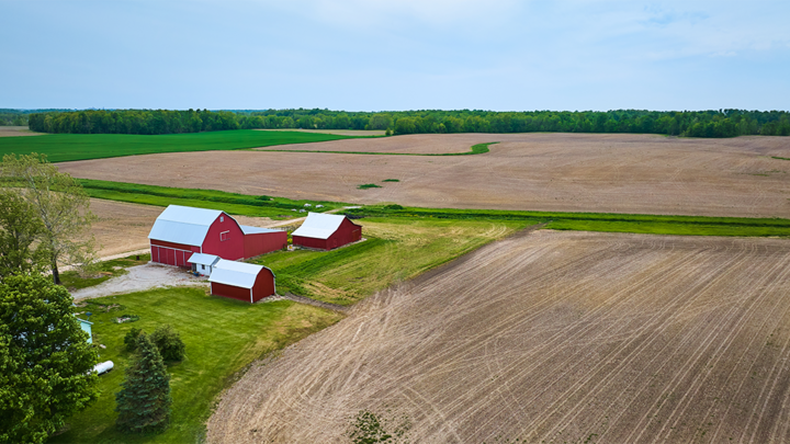 aerial view of farmland and barns