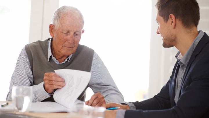 financial advisor speaking to man