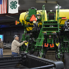 Grower examining a new sprayer at the Soybean Day and Machinery Expo