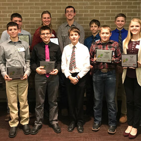 Figure 1. Youth attending the Innovative Youth Corn Challenge banquet were recognized for their efforts throughout the 2017 crop season to test corn production practices in science-based field trials. (Back Row L-R: Isaac Stromberg, Kade Stromberg, Juliana Loudon, Korbin Kudera, Hayden Beccard, Levi Schiller, James Rolf. Front Row L-R: Gavin Nelson, Rylan Nelson, Nolan Beccard, Landon Hasenkamp and Payton Schiller.) (Photos by Brandy VanDeWalle)