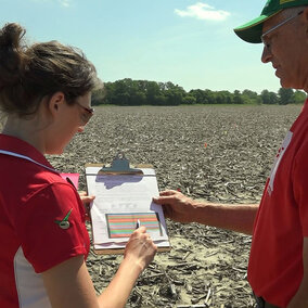 Laura Thompson and Dean Stevens in the field