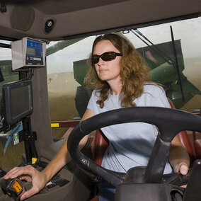 woman driving a tractor