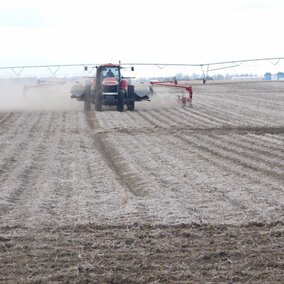Tractor spraying field