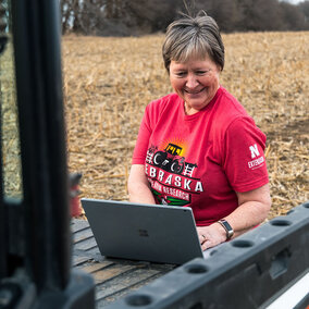 Farmer using online tool in field