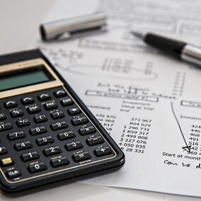 Calculator with financial papers