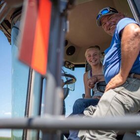 Farmers in tractor