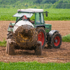 Tractor spreading manure