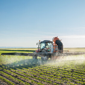 Tractor spraying field