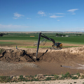 Digging crane in field