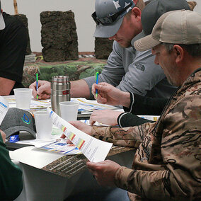 Soil school attendees working