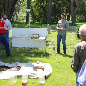 Soil Health School participants watch outdoor demo 