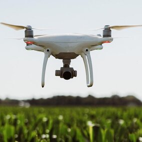 Drone flying over field