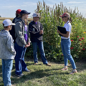 Colfax County #2 team listens to educator in field