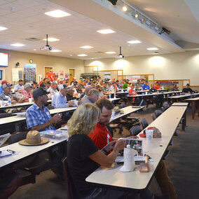 Attendees of expo listen to presentation