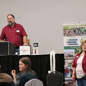 Dan Hinman speaks at podium