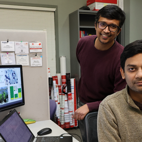 Rajib Saha and Niaz Bahar Chowdhury beside computer