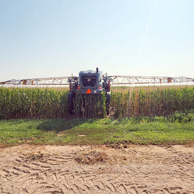 Highboy interseeder in field