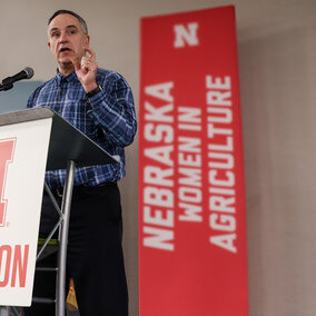 Man stands at podium