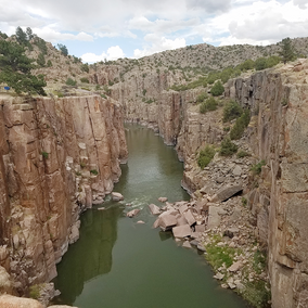 A canyon split by river water