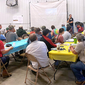 Attendees listen to presentation at conference