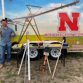 man stands near mobile lab