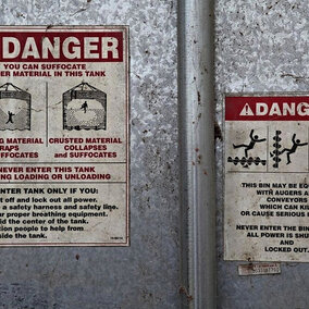 Warning sign on the side of a grain bin