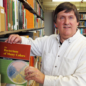 UNL Extension Plant Pathologist Bob Harveson with his book.