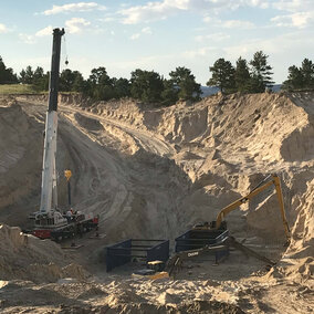 Excavation continues above the tunnel collapse. A series of three trench boxes, each 10 feet tall by 20 feet wide by 20 feet long will be dropped down into the space as soil is removed. (Photo courtesy the Goshen Irrigation District)