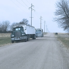 Trucks loading grain