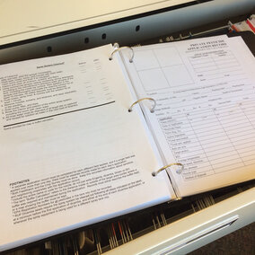 Open notebook displaying record page for pesticide applications