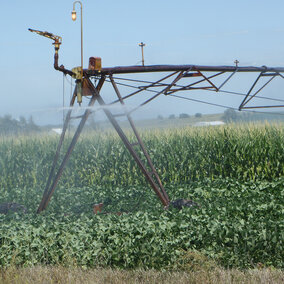 Center pivot irrigation system watering a field