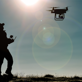 Man operates drone in field