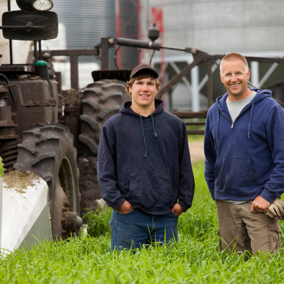 Man and son on farm