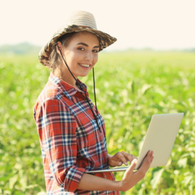 Farmer with laptop in field