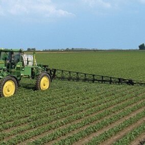 herbicide being applied to soybean field