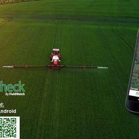 Tractor spraying pesticide with FieldCheck graphics