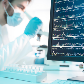 Lab worker behind computer