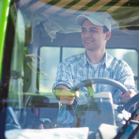 Man operating tractor