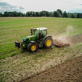 tractor preparing field for planting