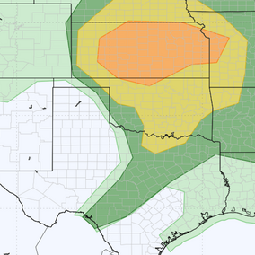Weather map showing risk areas with green, yellow, and orange shading over central and southern U.S. states.