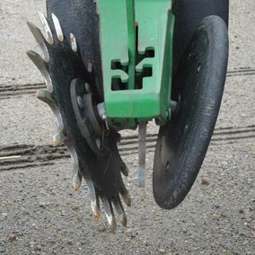 By replacing one solid closing wheel with a spiked one, closing the seed-vee becomes easier in a variety of conditions.