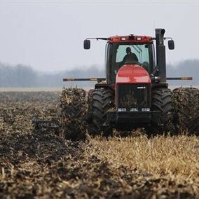 Tractor tilling in wet soils