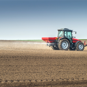 Tractor spraying fertilizer