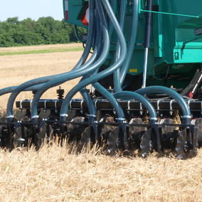 Manure being injected in wheat residue