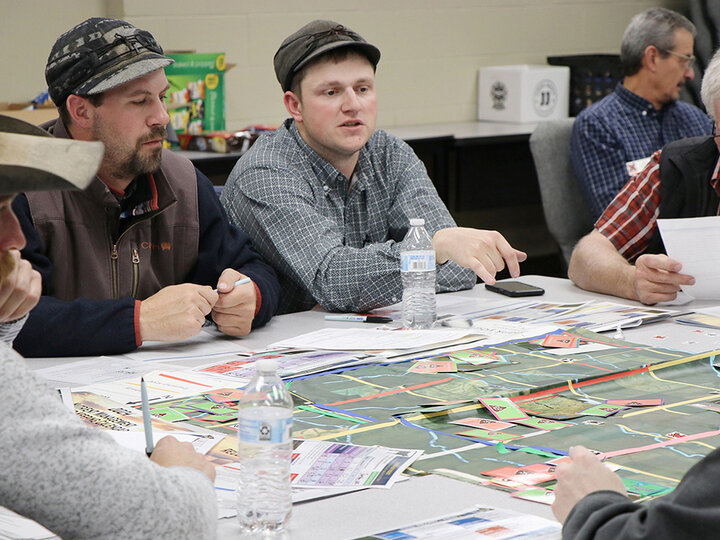 Two men sitting at table talking