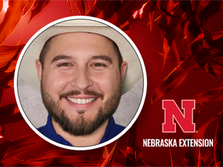 Portrait of Joshua Villazana, PSEP/Chemigation Coordinator with Nebraska Extension, shown against a red corn leaf background with the Nebraska Extension logo.