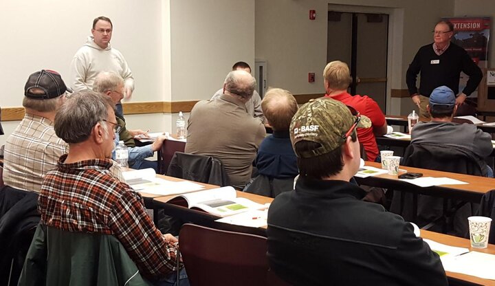Photo of growers sharing results in a meeting